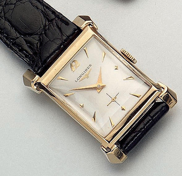 Longines. A 14ct gold wristwatch
