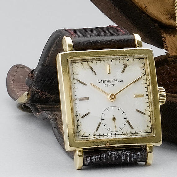 Patek Philippe. A gold square wristwatch with presentation case