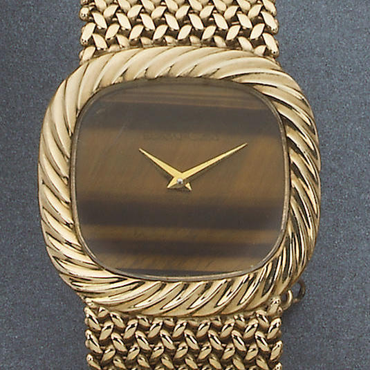 Beuche Girod. A large 9ct gold bracelet watch with tigers eye dial