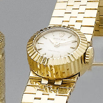 Rolex. A lady's 18ct gold wristwatch with detachable bracelet