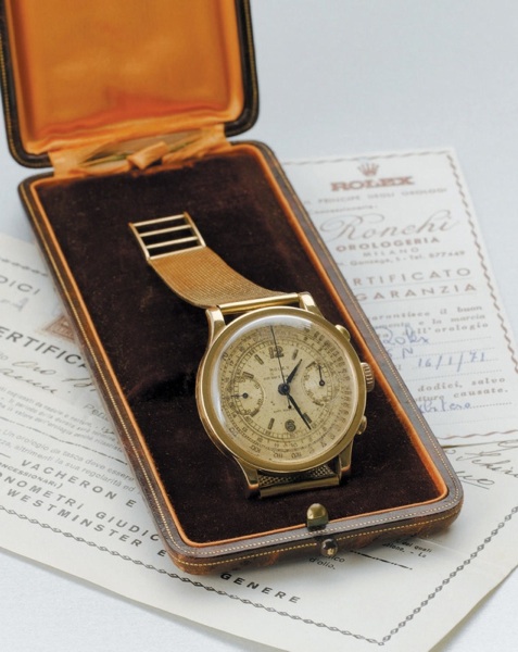 Rolex. A fine and rare 18ct gold chronograph wristwatch with factory box and papers