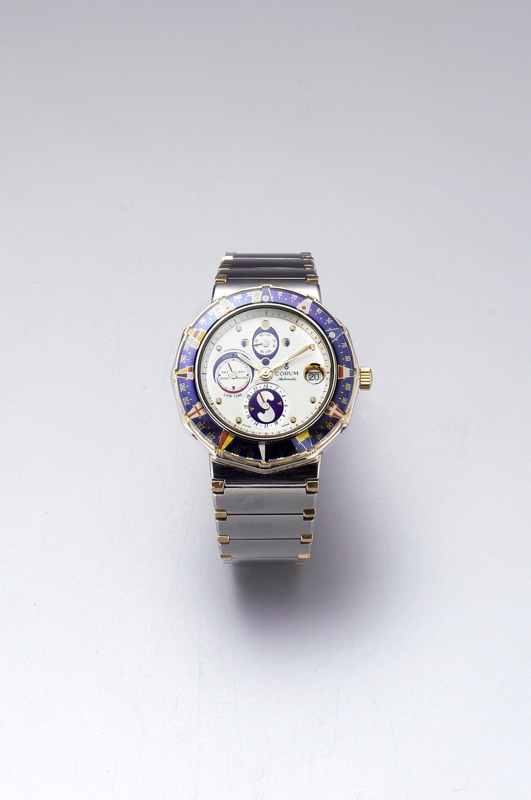 Corum. A steel and gold automatic Yachting bracelet watch with 24hr, tide, date and lunar indicators