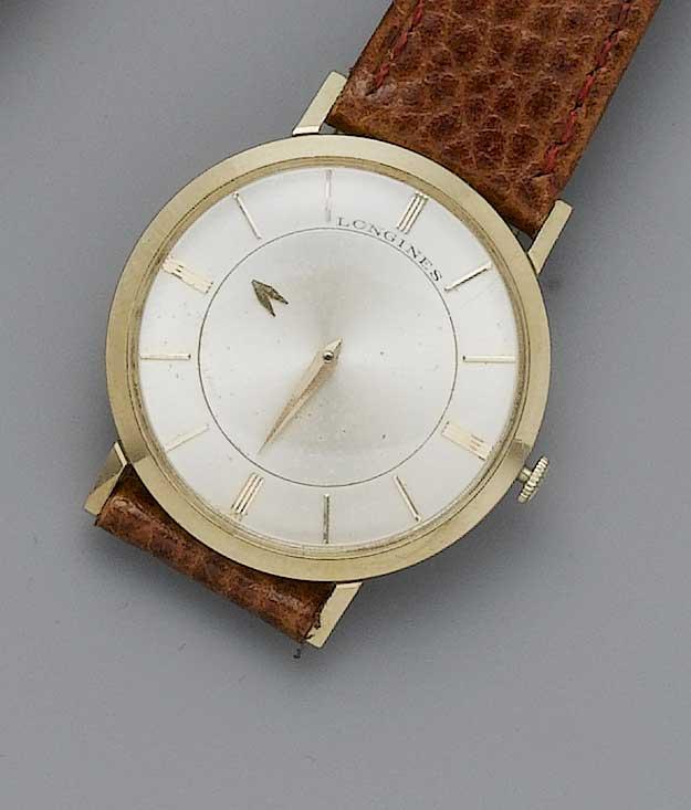 Longines.An 18ct gold mystery watch