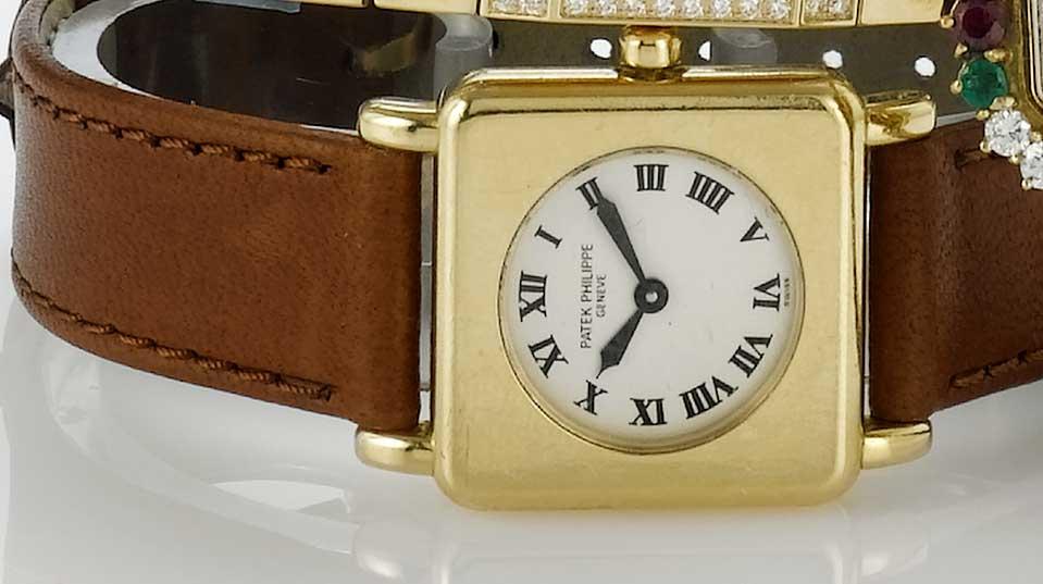 Patek Philippe. An 18ct gold square case quartz wristwatch