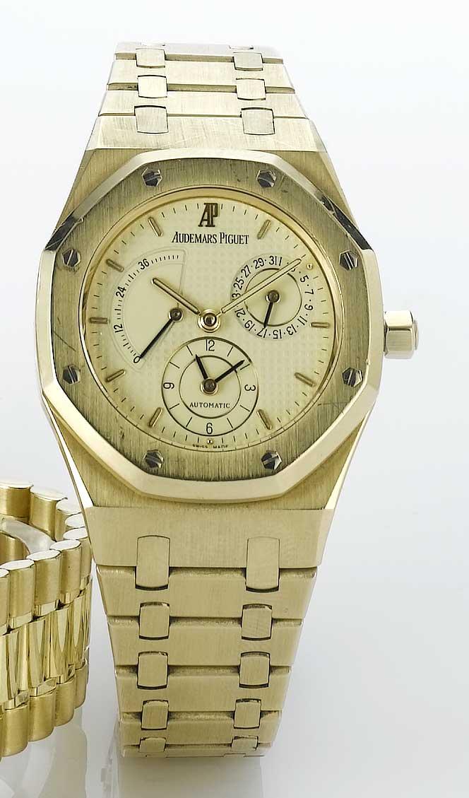 Audemars Piguet. A fine 18ct gold automatic dual time calendar watch with power reserve