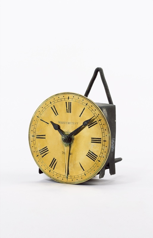 A mid 19th century brass 'hook and spike' wall alarm timepiece