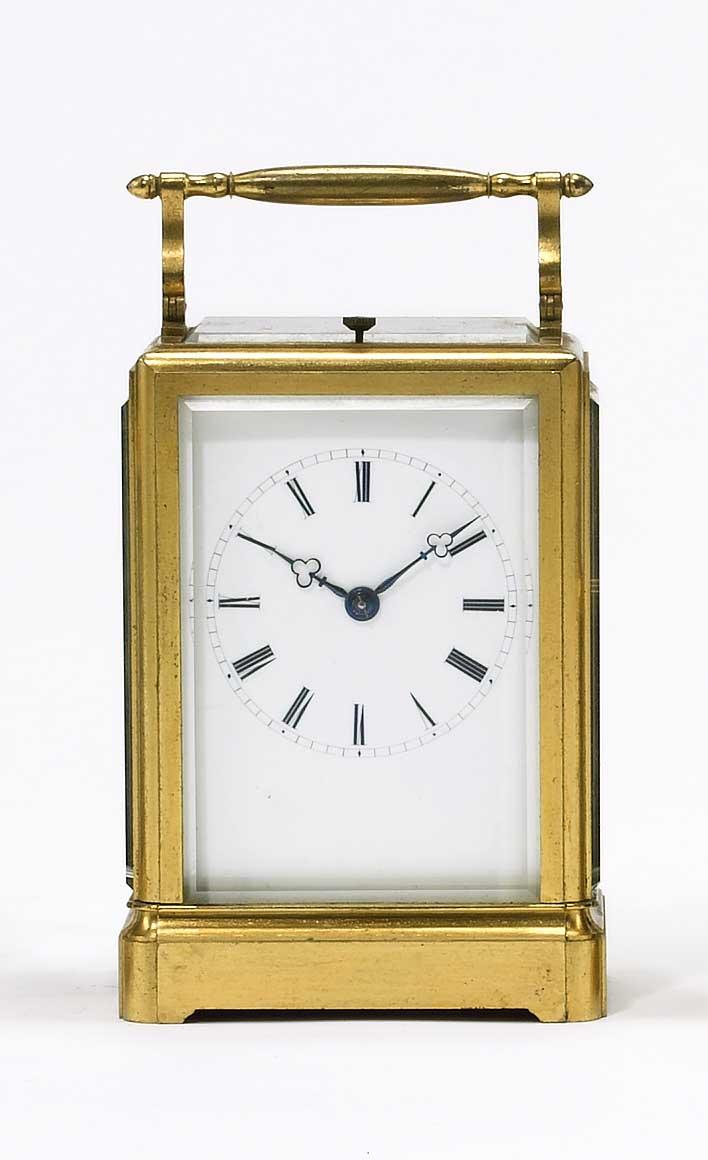 A good mid 19th century French gilt brass bell striking carriage clock in a one piece case