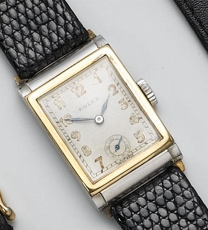 Rolex. A stainless steel rectangular wristwatch