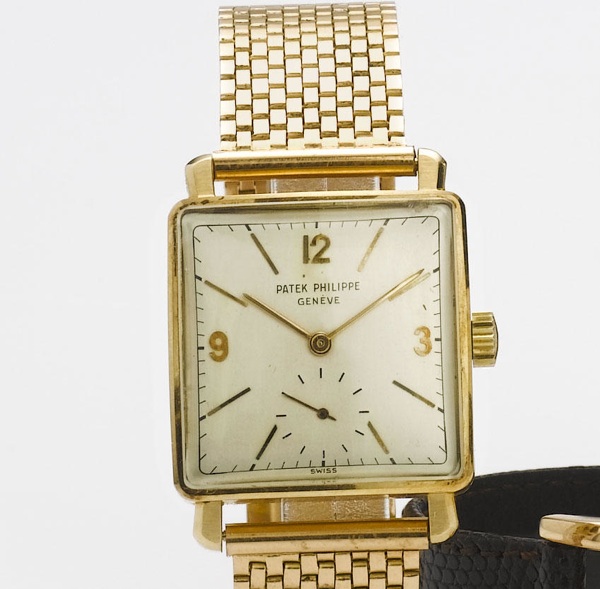 Patek Philippe. An 18ct gold square case wristwatch with brick link bracelet