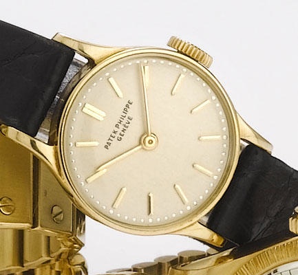 Patek Philippe. An 18ct gold wristwatch with original box