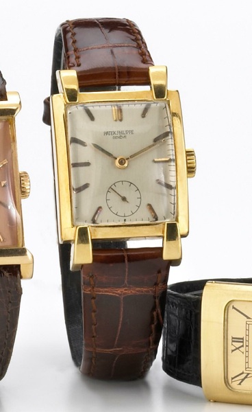Patek Philippe. A fine and unusual 18k gold large rectangular wristwatch with prominent lugs