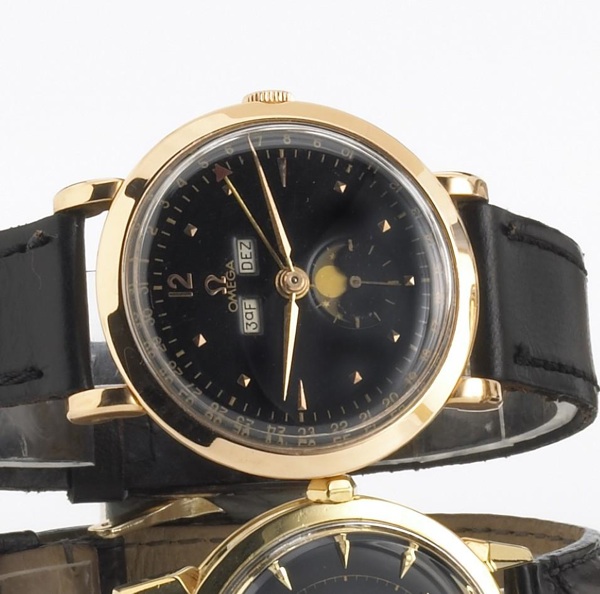 Omega. An 18k pink gold triple calendar wristwatch with phases of the moon