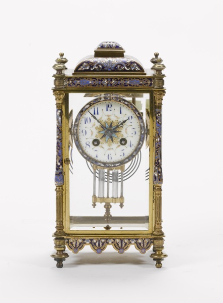 A late 19th century French champleve decorated brass four-glass mantel clock