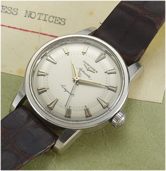 Longines. A unique and historically interesting automatic stainless steel wristwatch presented by Longines to Captain John Hackett for his record breaking flight from London to New York and back in 14 hours 21 minutes and 45 seconds on the 23rd of August 