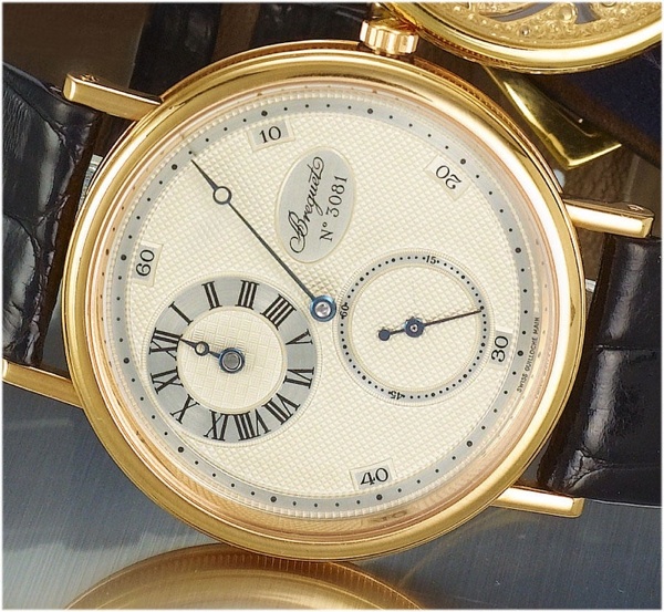 Breguet. A fine and rare 18ct pink gold gentleman's wristwatch with regulator dial for the hours with transparent case back