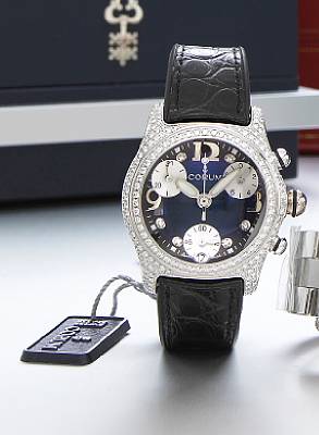 Corum. A mid-size 18k white gold and diamond set chronograph wristwatch with calendar