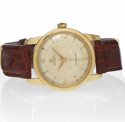 Omega. An 18k gold self-winding wristwatch in water resistant type case