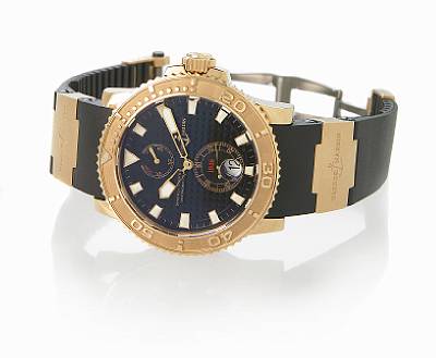 Ulysse Nardin. A fine 18k rose gold and rubber self-winding calendar wristwatch with up/down indicator