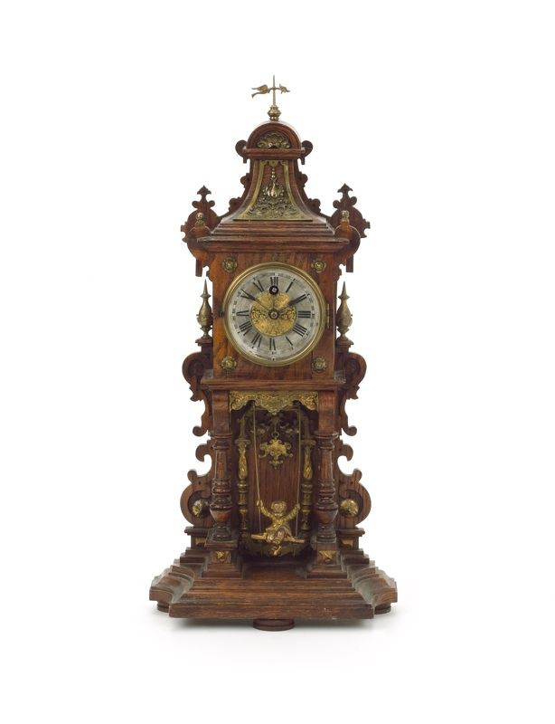 A late 19th century German swinging cherub timepiece
