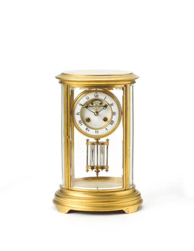 A late 19th century French lacquered brass four glass mantel clock