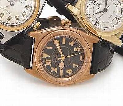 Rolex. A stainless steel and pink gold self-winding wristwatch with black dial