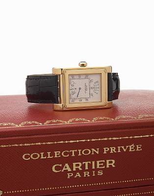 Cartier. A fine and rare special edition 18k gold large rectangular digital display wristwatch with calendar