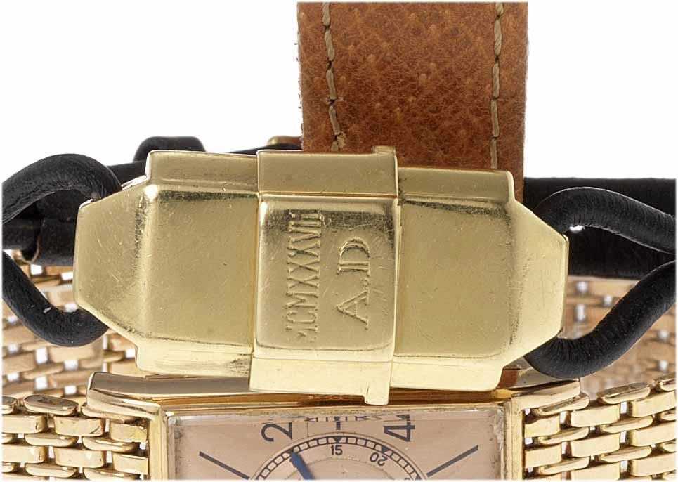 Cartier. A fine and rare lady's 18ct gold concealed dial wristwatch