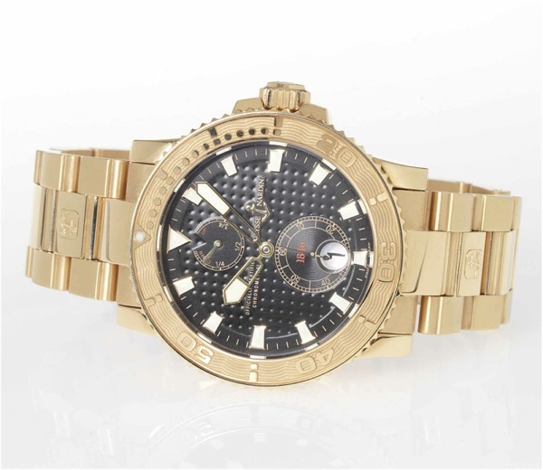 Ulysse Nardin. A fine 18ct gold automatic calendar bracelet watch with power reserve and a platinum Ulysse Nardin deployant buckle, together with fitted box and certificate