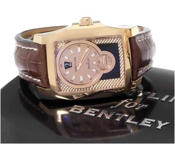 Breitling. A fine 18ct pink gold jumping hour automatic calendar wristwatch together with fitted box and papers