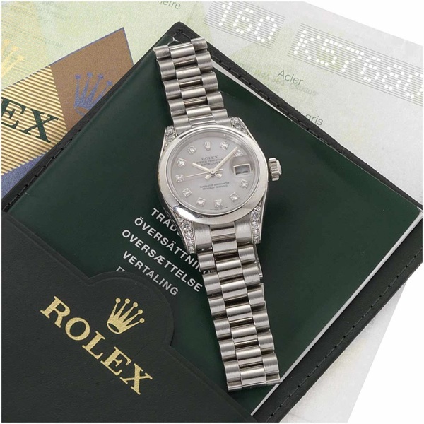 Rolex. A fine lady's platinum and diamond automatic centre seconds calendar bracelet watch