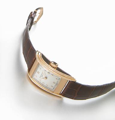 Patek Philippe. A fine and rare 18k pink gold curved rectangular 'drivers' wristwatch