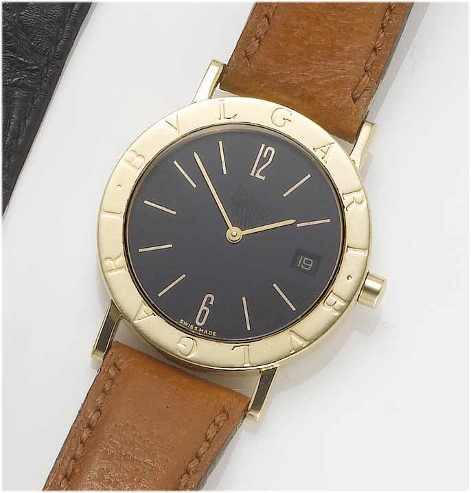 Bulgari. A lady's 18ct gold calendar wristwatch