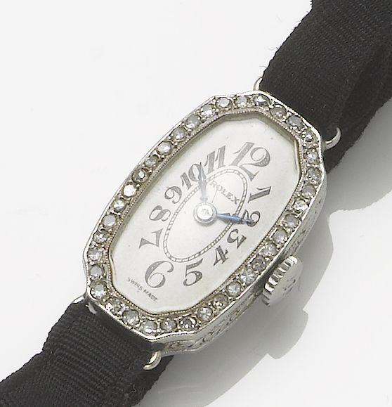 Rolex. A lady' s 18ct white gold diamond set cocktail watch