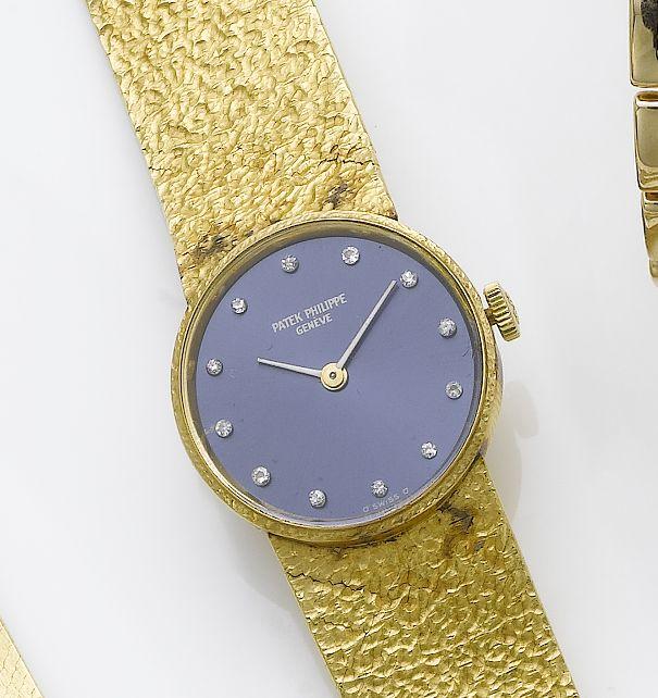 Patek Philippe. A lady's 18ct gold and diamond set bracelet watch