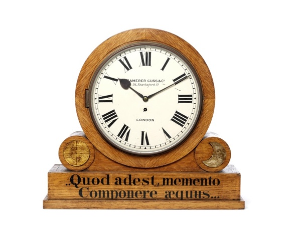 A late 19th century oak drumhead mantel clock