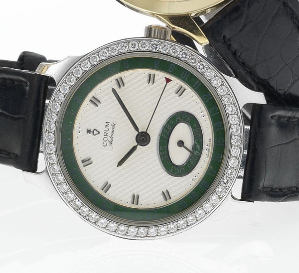 Corum. A fine limited edition 18ct white gold diamond set automatic calendar wristwatch together with presentation box