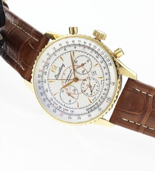 Breitling. A fine 18ct gold automatic chronograph calendar wristwatch together with fitted box and papers