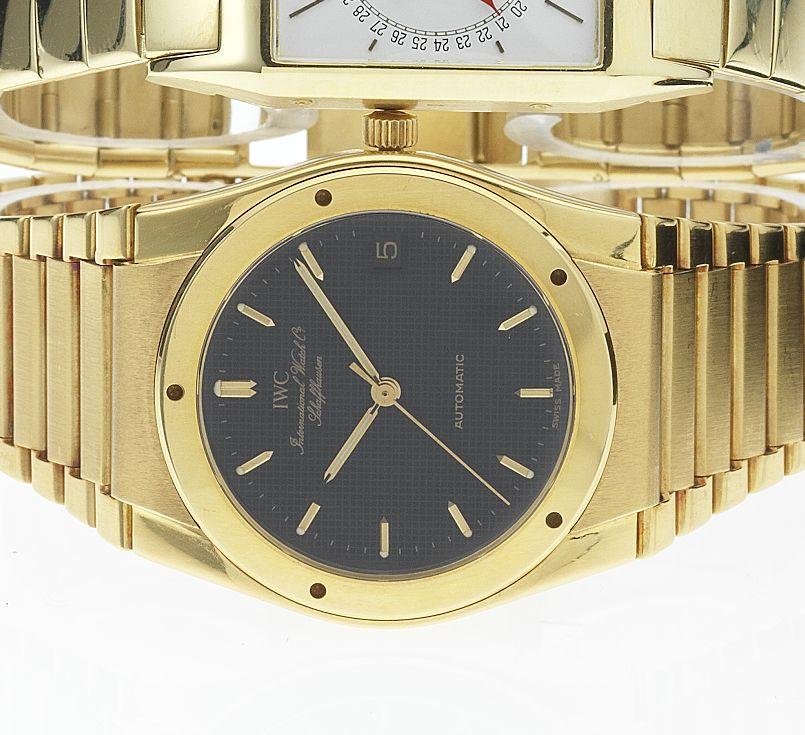 IWC. A fine 18ct gold automatic centre seconds calendar bracelet watch