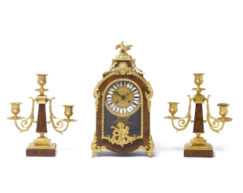 A late 19th century French burr walnut and ormolu clock garniture