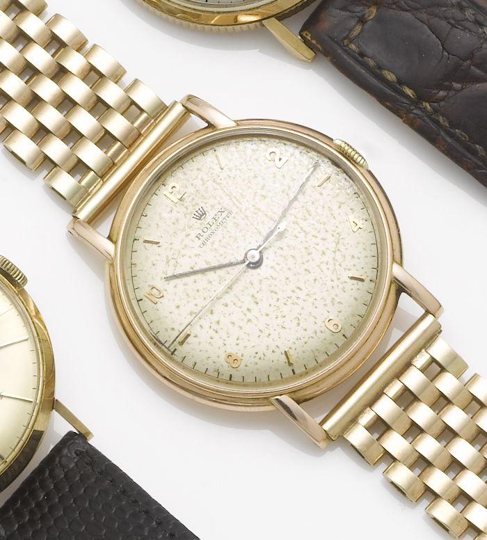 Rolex. A 14ct gold centre seconds watch together with a 9ct gold bracelet