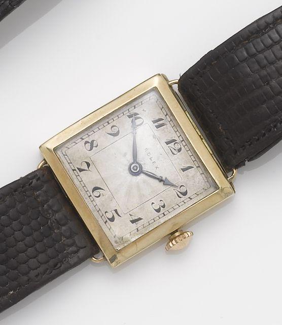 Rolex. An 9ct gold square case wristwatch