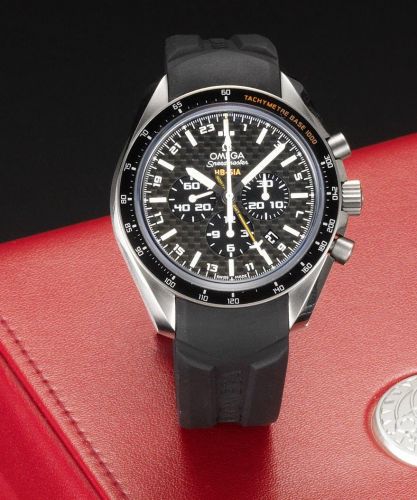 Omega. A titanium automatic chronograph calendar twin time zone wristwatch with Co-Axial escapement, together with fitted box and papers