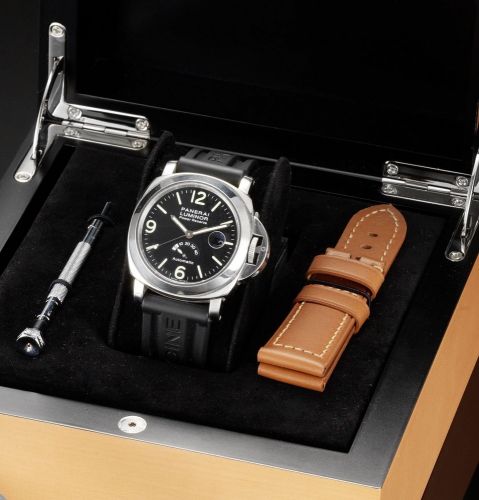 Officine Panerai. A fine stainless steel automatic centre seconds calendar wristwatch with power reserve indication, together with fitted box and papers