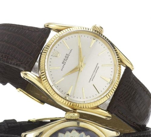 Rolex. An 18ct gold automatic centre seconds wristwatch