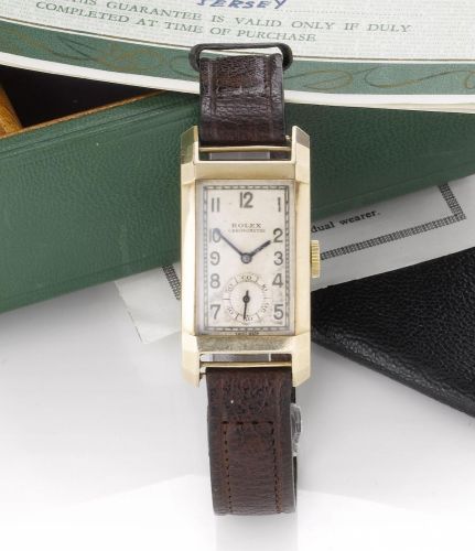 Rolex. A fine 18ct gold curved case rectangular wristwatch