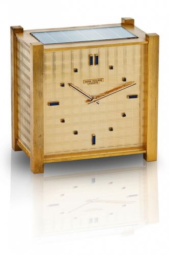 Patek Philippe. A fine and rare brass solar desk clock