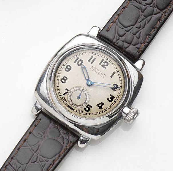 Rolex. A stainless steel manual wind wristwatch