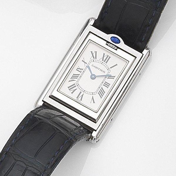 Cartier. A stainless steel quartz reversible wristwatch with box and papers