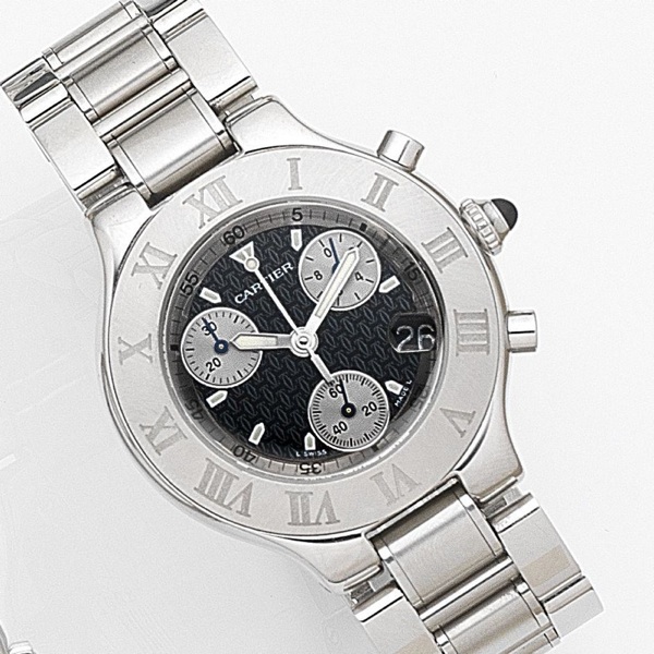 Cartier. A stainless steel quartz chronograph calendar bracelet watch with box and papers