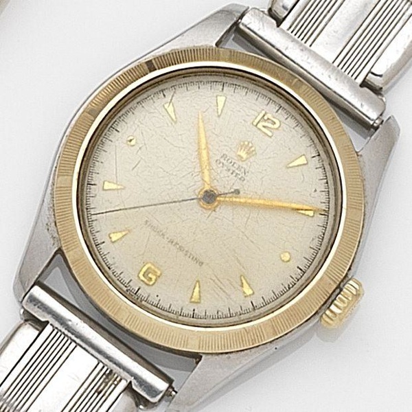 Rolex. A stainless steel and gold manual wind centre seconds bracelet watch